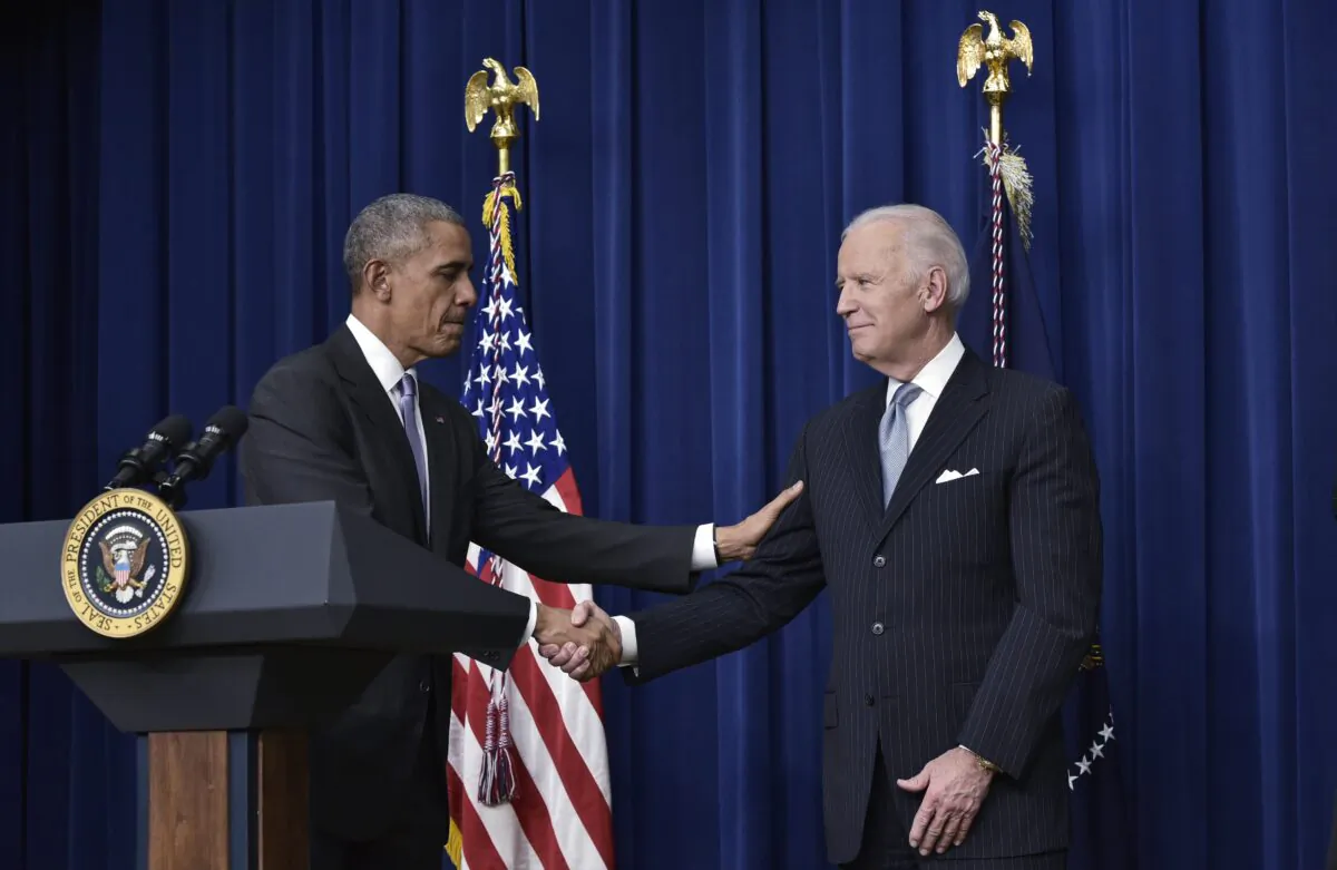 President Barack Obama shakes hands with Vice President Joe Biden in Washington on Dec. 13, 2016. (Mandel Ngan/AFP via Getty Images)