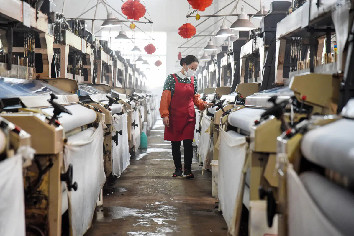 An employee works at a textile factory in Handan in China's northern Hebei Province, on April 29, 2020. (STR/AFP via Getty Images)