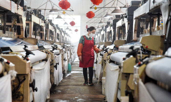 An employee works at a textile factory in Handan in China's northern Hebei Province, on April 29, 2020. (STR/AFP via Getty Images)