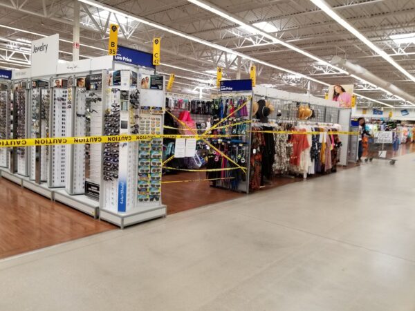 A yellow caution tape surrounds sections of merchandise at the Walmart