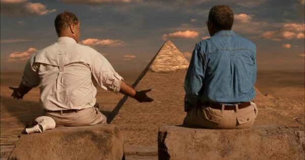 two men looking at pyramids