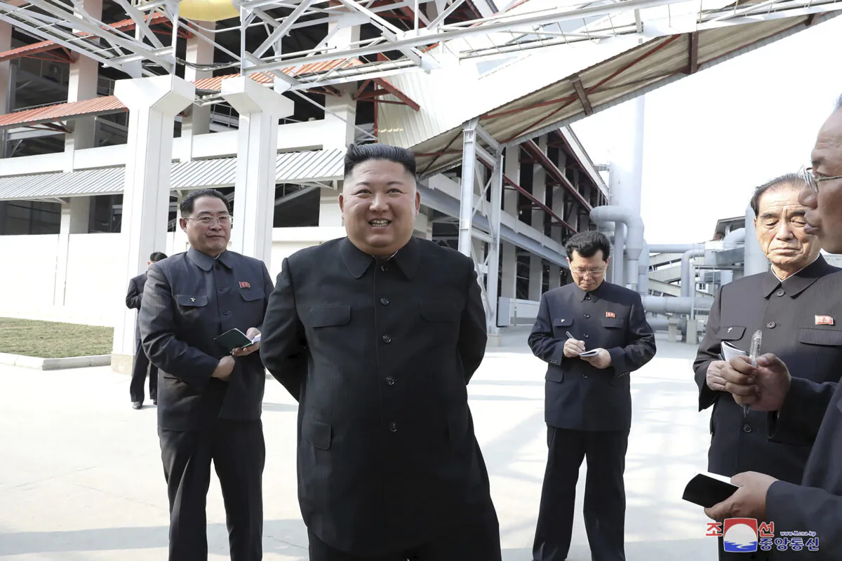 North Korean leader Kim Jong Un (C) visits a fertilizer factory in Sunchon, South Pyongan province, near Pyongyang, North Korea, in this May 1, 2020, photo provided by the North Korean government. (Korean Central News Agency/Korea News Service via AP)