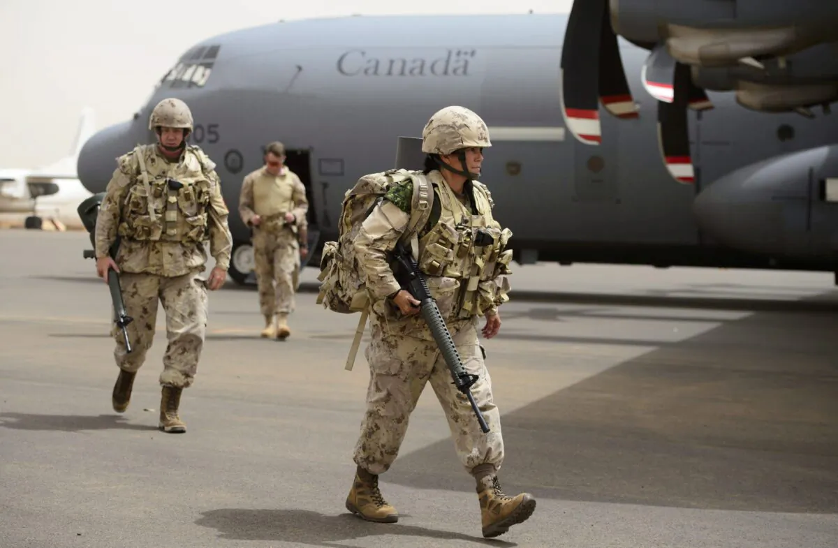 Canadian troops arrive at a U.N. base in Gao, Mali, on June 25, 2018. Deploying troops to conflict areas is part of Canada’s foreign aid program. (Sean Kilpatrick/The Canadian Press)