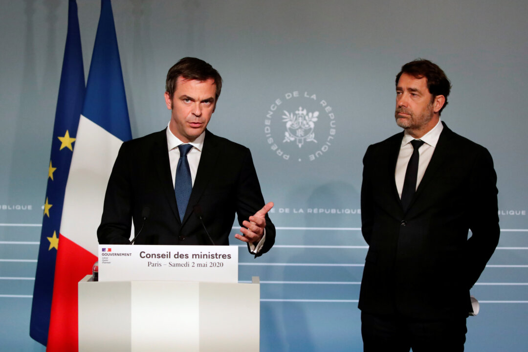 French Minister for Solidarity and Health Olivier Véran, and French Interior Minister Christophe Castaner attend a news conference after a cabinet meeting, as the spread of COVID-19 continues, at the Elysee Palace in Paris on May 2, 2020. (Francois Mori/Pool via Reuters)