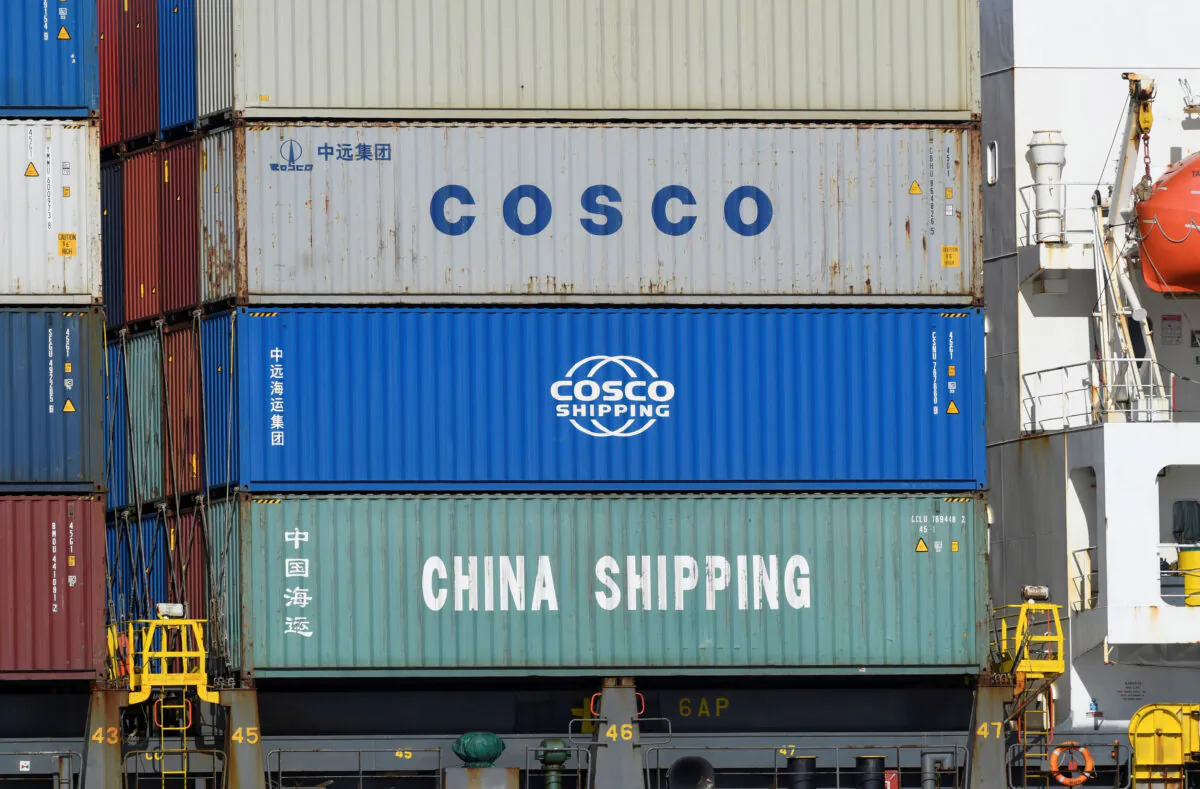 Containers of Chinese companies China Shipping and COSCO (China Ocean Shipping Company) are loaded on a container as it's leaving the port in Hamburg, Germany, on March 11, 2020. (Fabian Bimmer/File Photo/Reuters)