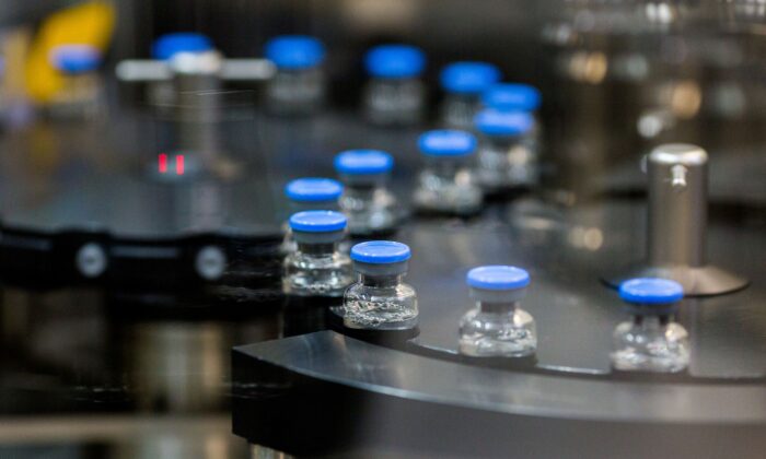 Vials of investigational COVID-19 treatment drug remdesivir are capped at a Gilead Sciences facility in La Verne, Calif., on March 18, 2020. (Gilead Sciences via Reuters)