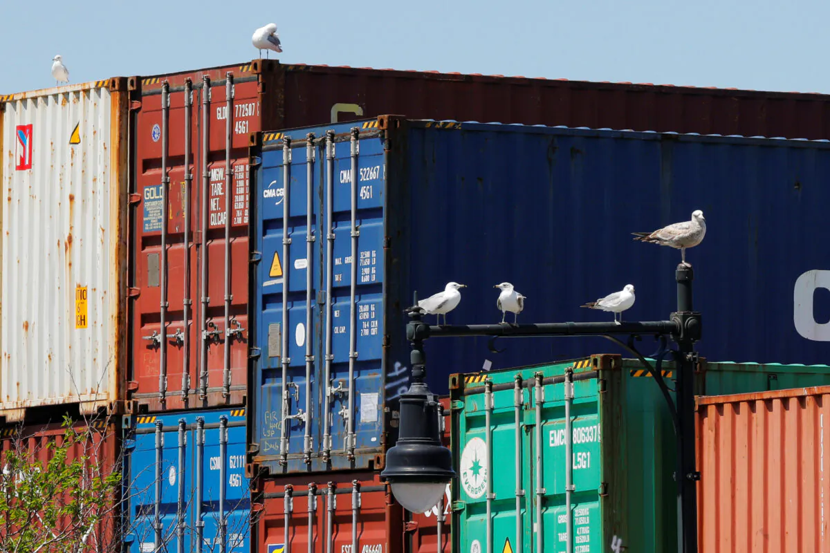 Shipping containers stacked at the Paul W. Conley Container Terminal in Boston, Mass., on May 9, 2018. (Brian Snyder/Reuters）