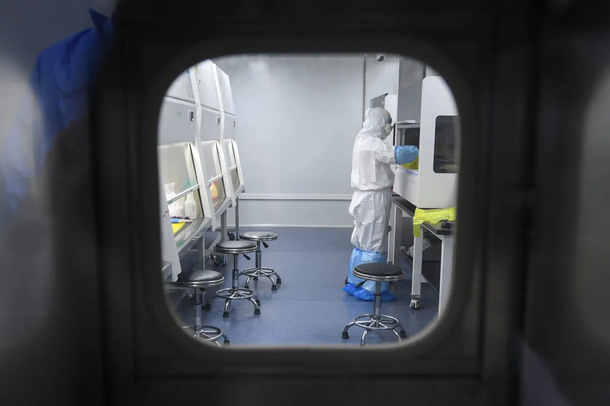 A BGI Group laboratory technician working at "Fire Eye" laboratory, in Wuhan, China, on Feb 6, 2020. (STR/AFP via Getty Images)