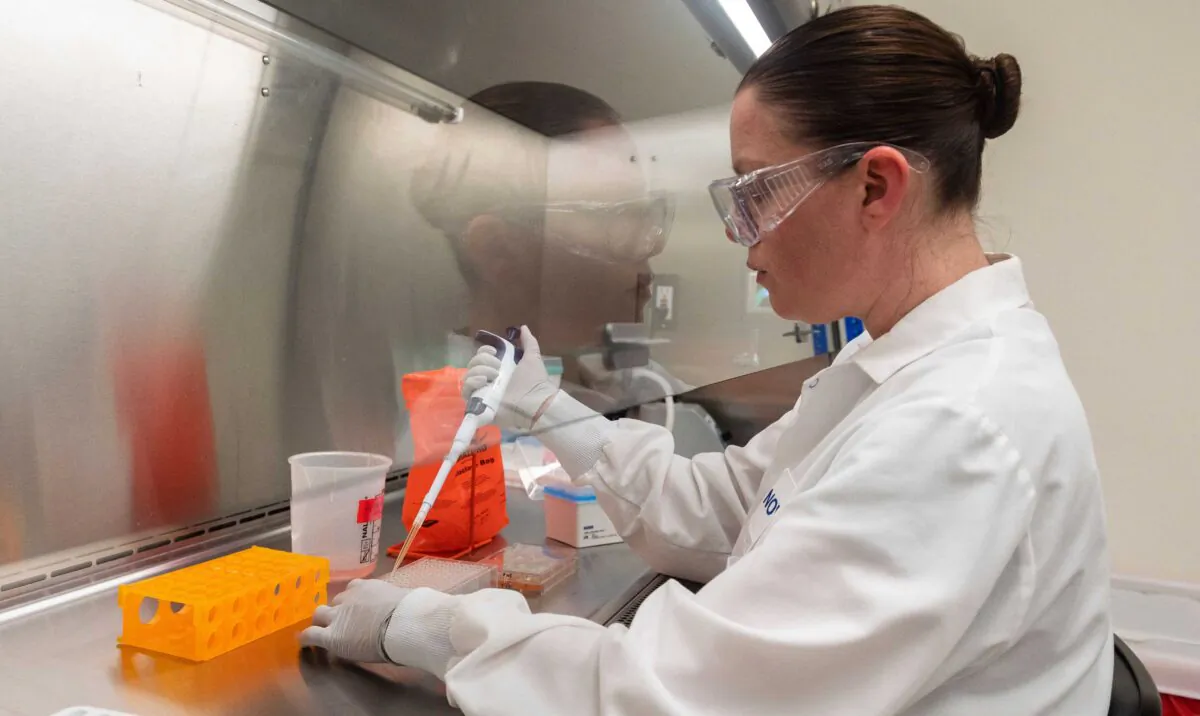 A doctor looks at protein samples at Novavax labs, one of the labs developing a vaccine for the COVID-19, in Rockville, Md., on March 20, 2020. (Andrew Caballero-Reynolds/AFP via Getty Images)