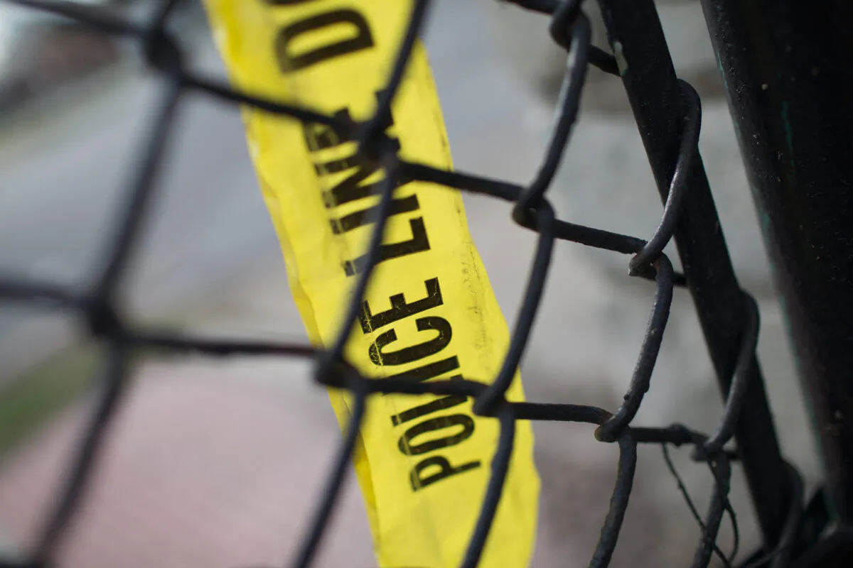 Remnants of crime scene tape remain on a fence in a file photo. (Scott Olson/Getty Images)