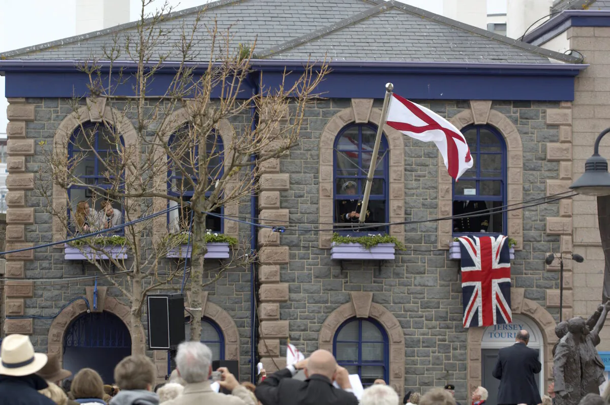 Reenactment of the raising of the flag, Liberation Day in Jersey, file photo. (Jersey Tourism/CC BY 2.0)