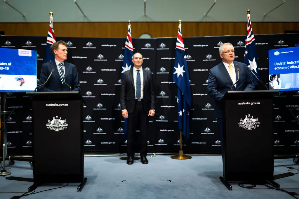 Australian Prime Minister Scott Morrison (R) speaks at a press conference alongside Australian Attorney-General Christian Porter (L) and Head of the National COVID-19 Coordination Commission Nev Power (C) at Parliament House on May 5, 2020 in Canberra, Australia. (Rohan Thomson/Getty Images)

