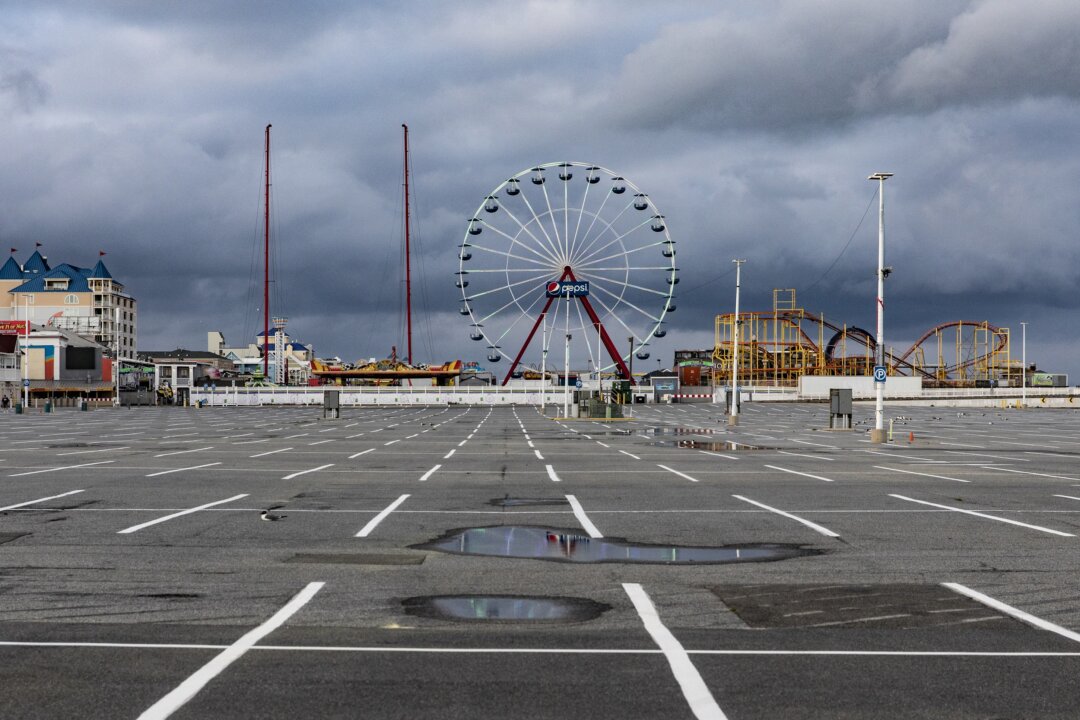 The parking lot and rides of Jolly Roger at the Pier remain empty and silent in Ocean City, Md., on April 26, 2020. (Samuel Corum/Getty Images)