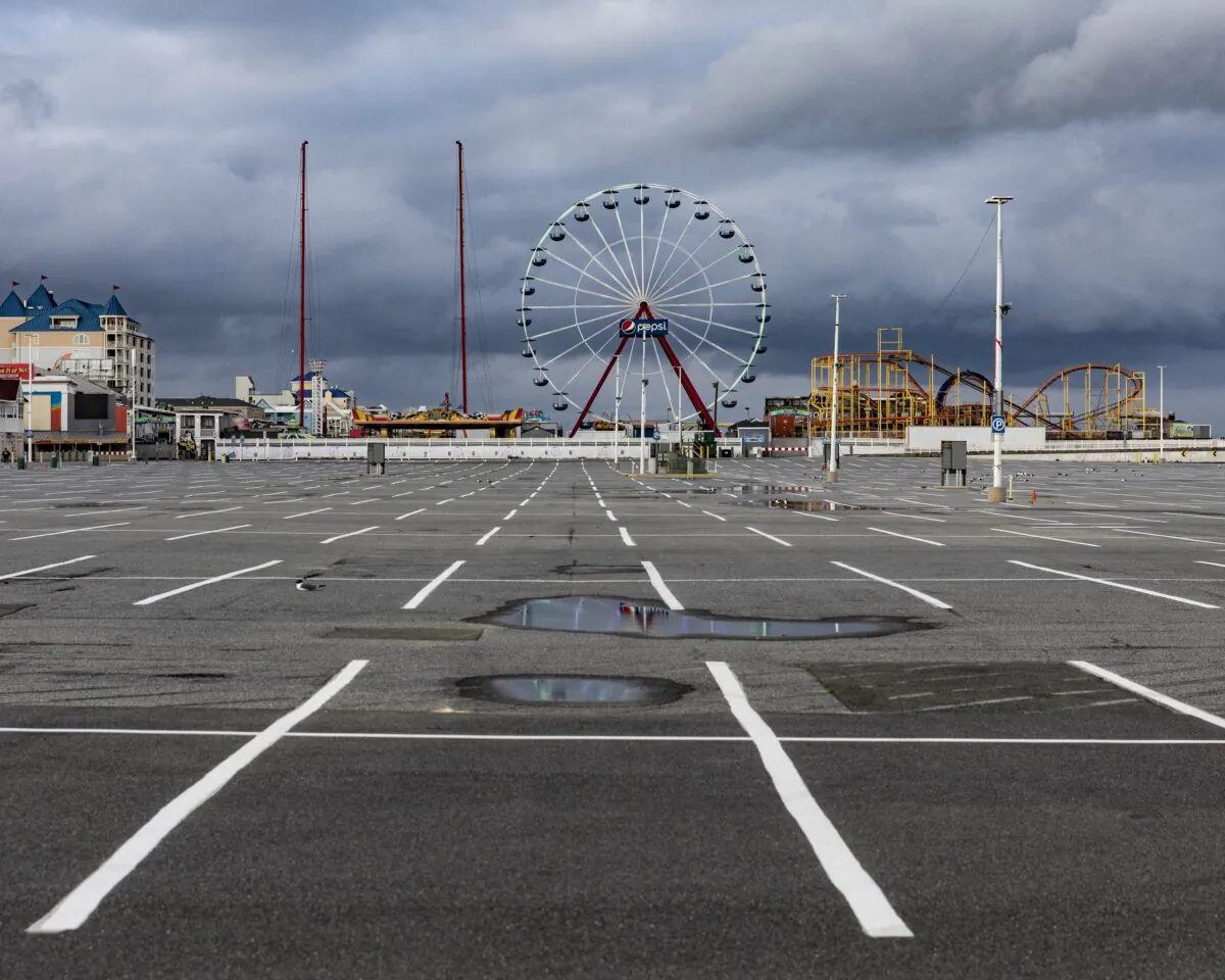 The parking lot and rides of Jolly Roger at the Pier remain empty and silent in Ocean City, Md., on April 26, 2020. (Samuel Corum/Getty Images)