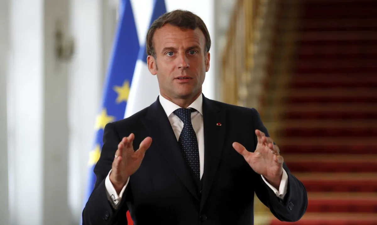 French President Emmanuel Macron speaks after a video-conference summit on vaccination at the Elysee Palace in Paris, France, on May 4, 2020. (Gonzalo Fuentes/Pool via AP)
