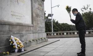 Chinese Police Threaten Virus Victim's Son Over Efforts to Build Memorial