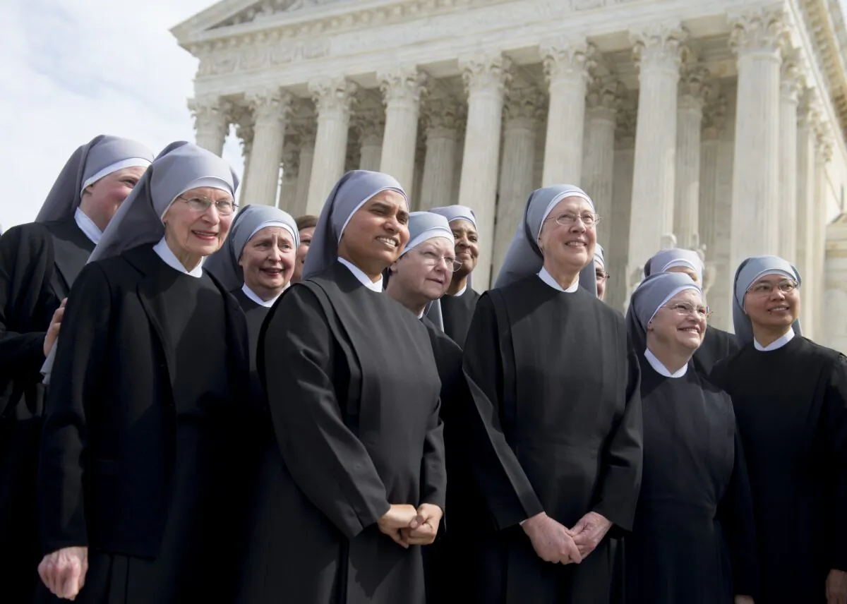 Nuns belonging to Little Sisters of Poor outside the Supreme Court in Washington on March 23, 2016. On May 6, 2020, counsel representing the order was again before the Supreme Court. (Saul Loeb/AFP via Getty Images)