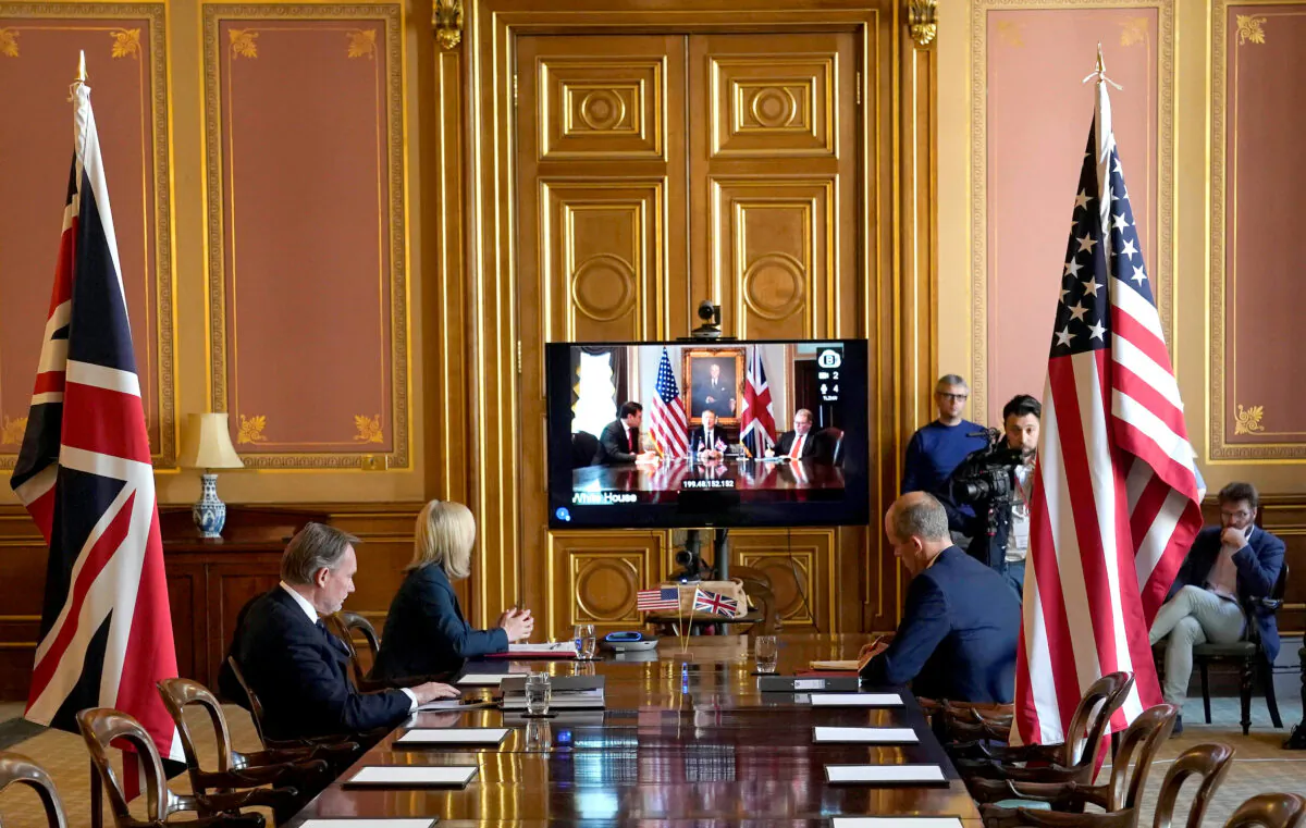 Britain's International Trade Secretary Liz Truss talks remotely from the Foreign Office to the U.S. Trade Representative Robert Lighthizer to begin negotiations for a trade agreement, in London on May 5, 2020. (Andrew Parsons/10 Downing Street/Handout via Reuters)