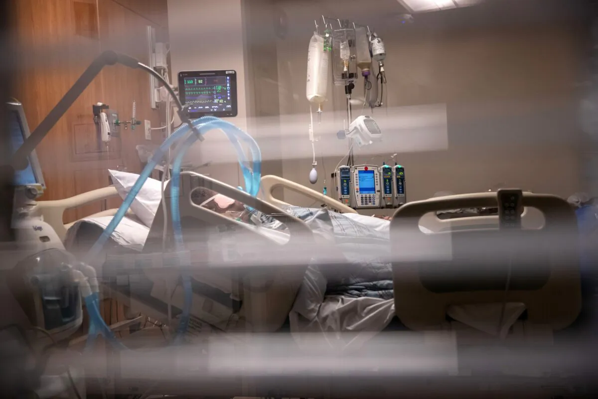 Breathing tubes hang next to a man with COVID-19 on a ventilator at a Stamford Hospital Intensive Care Unit in Stamford, Connecticut on April 24, 2020. (John Moore/Getty Images)