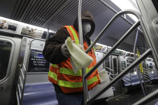 MTA officials work on trains for the disinfecting operations