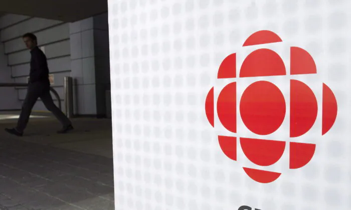 A man leaves the CBC building in Toronto in a file photo. (Nathan Denette/The Canadian Press)