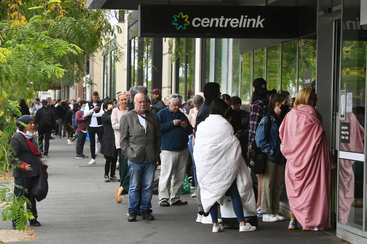 Hundreds of people queue outside a  Centrelink in Melbourne, on March 23, 2020 (William West/AFP via Getty Images)