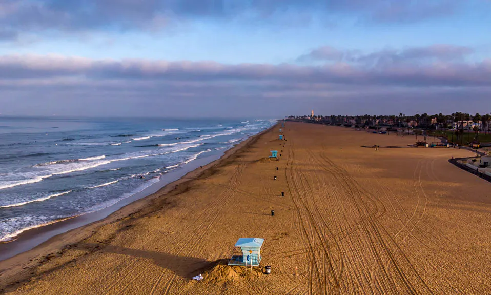 An aerial view shows an empty beach in Huntington Beach, Calif., on May 02, 2020. State officials reopened the last of the county’s beaches for active use on May 7.  (Apu Gomes/AFP via Getty Images)