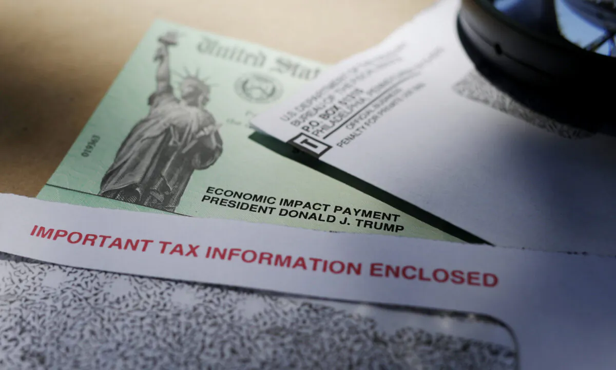 President Donald Trump's name is seen on a stimulus check issued by the IRS to help combat the adverse economic effects of the COVID-19 outbreak, in San Antonio, Texas, on April 23, 2020. (Eric Gay/AP Photo)