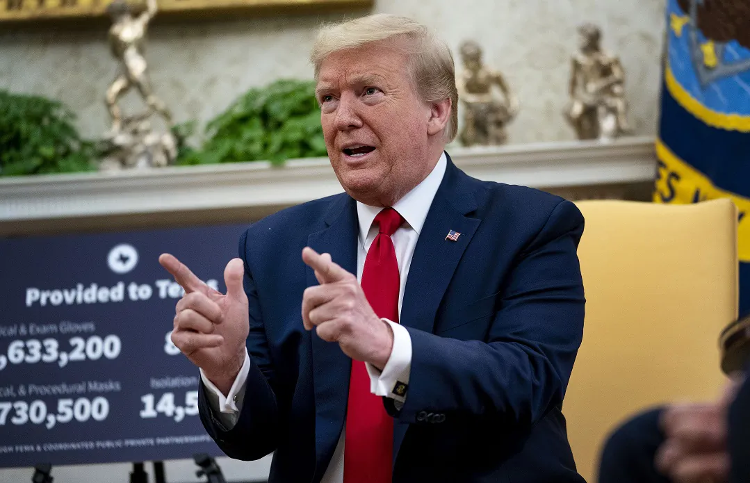 President Donald Trump speaks to reporters while hosting Texas Governor Greg Abbott about what his state has done to restart business during the novel coronavirus pandemic in the Oval Office at the White House in Washington on May 7, 2020. (Doug Mills/Getty Images)
