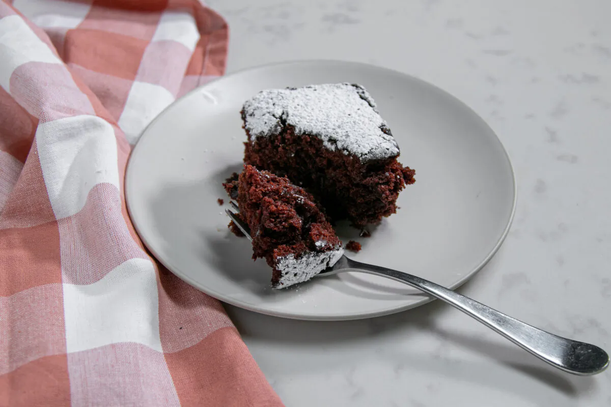 The recipe makes a tender, chocolate-y cake, with coveted edge pieces that chew almost like a cake-meets-brownie. (Chung I Ho/The Epoch Times)