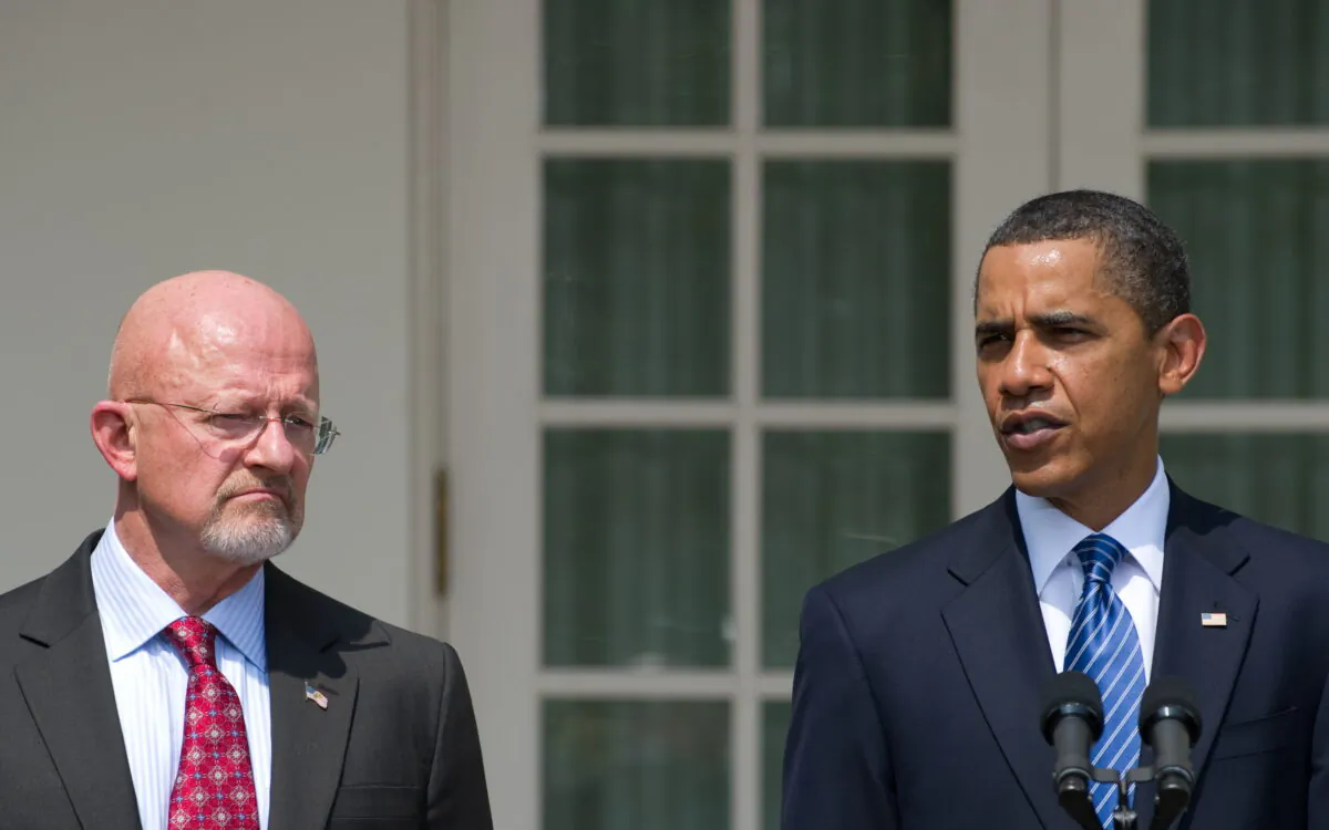 President Barack Obama speaks alongside retired General James Clapper, Obama's nominee for director of national intelligence, during the announcement in the Rose Garden of the White House in Washington on June 5, 2010. (Saul Loeb/AFP/Getty Images)