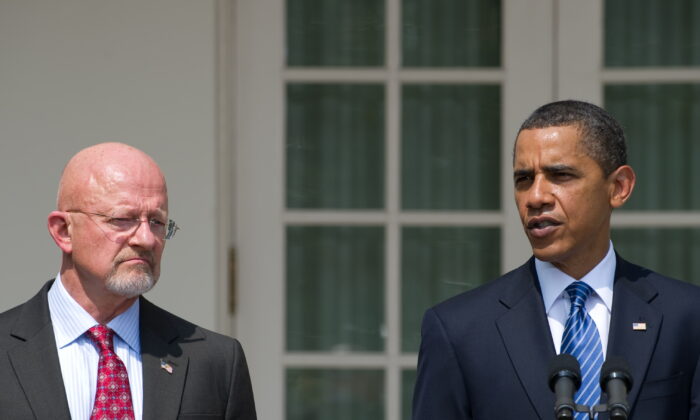 President Barack Obama speaks alongside retired General James Clapper, Obama's nominee for director of national intelligence, during the announcement in the Rose Garden of the White House in Washington on June 5, 2010. (Saul Loeb/AFP/Getty Images)