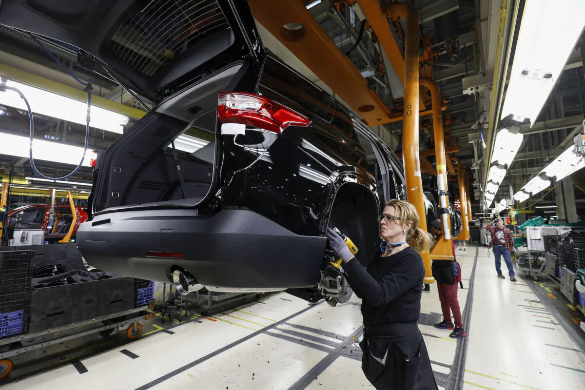 General Motors Chevrolet Traverse and Buick Enclave vehicles go through the assembly line at the General Motors Lansing Delta Township Assembly Plant in Lansing, Michigan,on Feb.21, 2020. (Bill Pugliano/Getty Images)