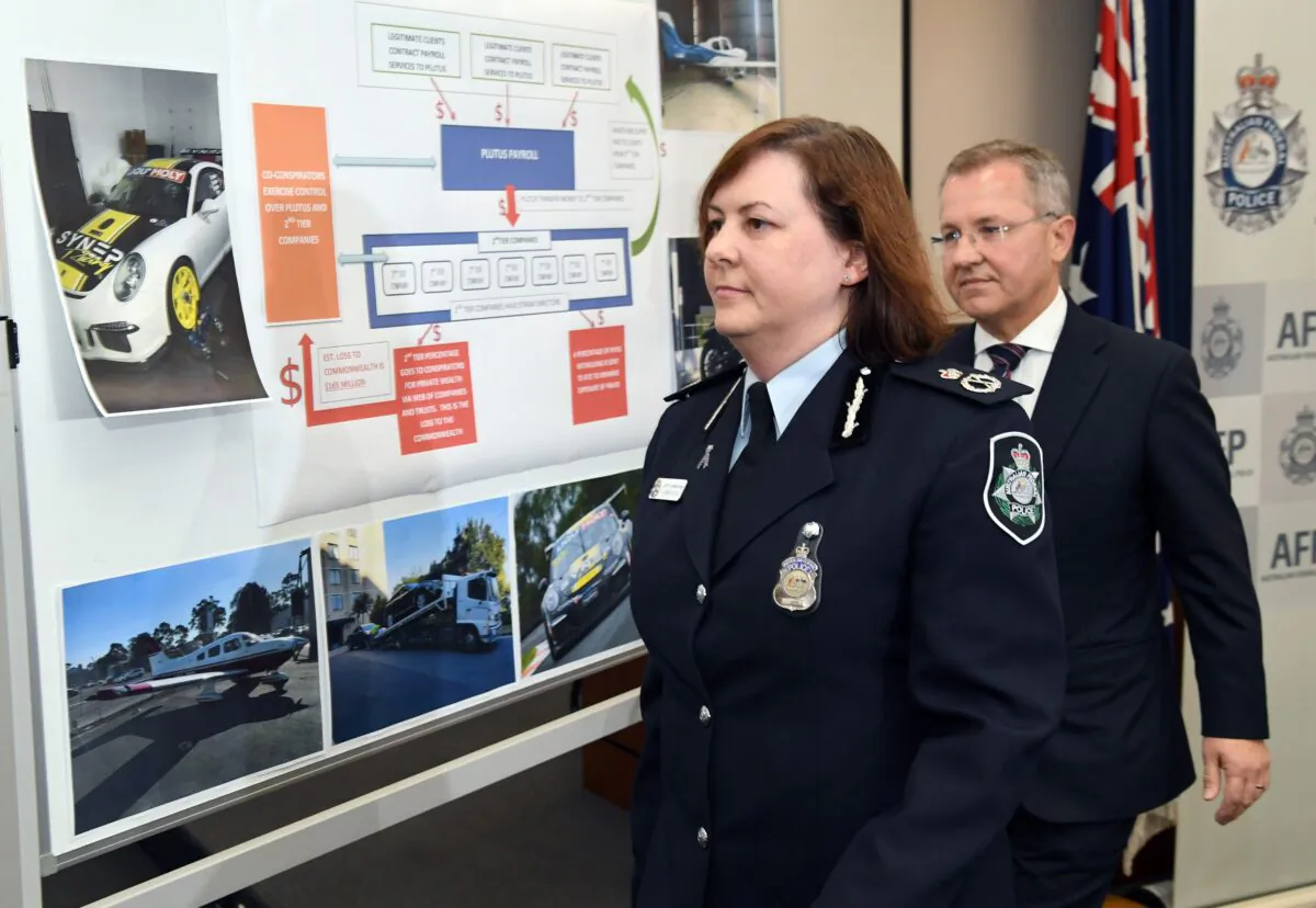 Australian Federal Police Deputy Commissioner Leanne Close (L) leaves a press conference with Australian Taxation Office (ATO) Acting Commissioner of Taxation Andrew Mills (R) after the AFP smashed a massive tax fraud syndicate and seized planes, guns, and luxury cars in Sydney on May 18, 2017.(Willian West/ Getty Images)