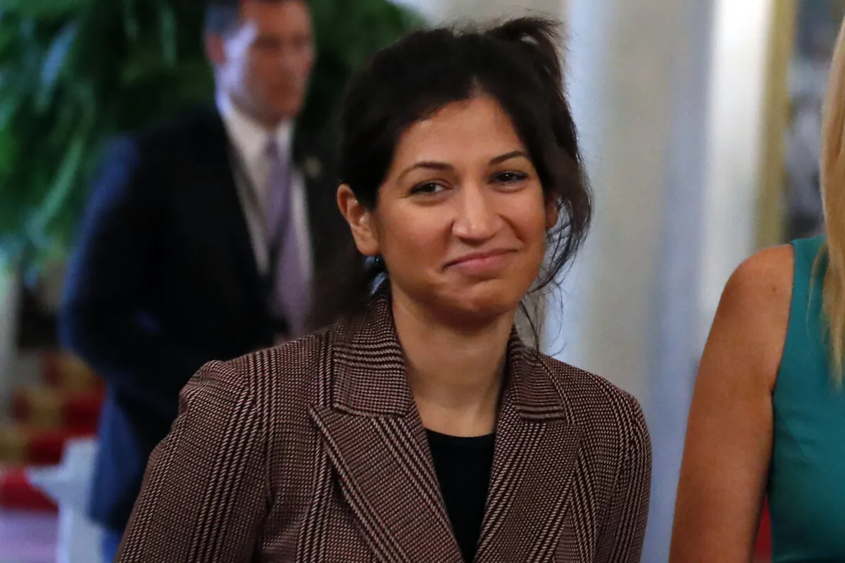 Katie Miller, press secretary for Vice President Mike Pence, listens as President Donald Trump speaks about reopening the country during a roundtable with industry executives, in the White House in Washington on April 29, 2020. (Alex Brandon/AP Photo)