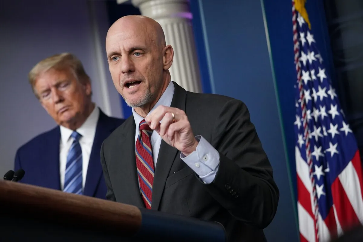 FDA Commissioner Dr. Stephen M. Hahn speaks as President Donald Trump listens during a briefing on the CCP virus at the White House in Washington on April 21, 2020. (Mandel Ngan/AFP/Getty Images)