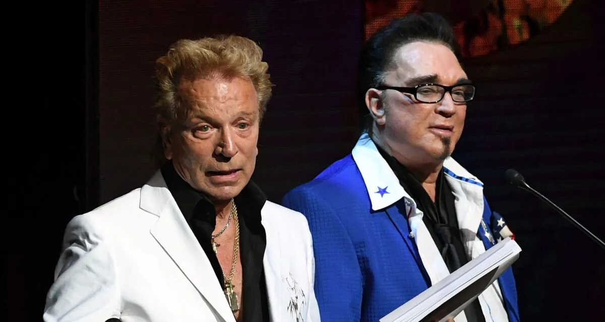 Siegfried Fischbacher (L) and Roy Horn speak during Criss Angel's HELP (Heal Every Life Possible) charity event at the Luxor Hotel and Casino benefiting pediatric cancer research and treatment in Las Vegas, Nevada, on Sept. 12, 2016. (Ethan Miller/Getty Images)