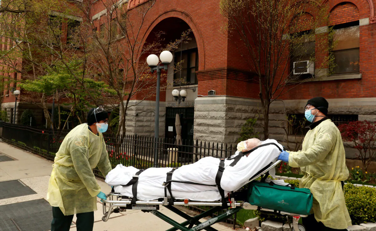 Emergency Medical Technicians (EMTs) wheel a man out of the Cobble Hill Health Center nursing home during an ongoing outbreak of COVID-19 in the Brooklyn borough of New York City on April 17, 2020. (Lucas Jackson/Reuters)