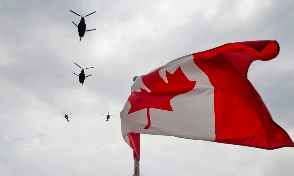Canadian Forces CH-47 Chinook helicopters participate in a flyover of Parliament Hill in Ottawa, on May 9, 2014. (Justin Tang/The Canadian Press)