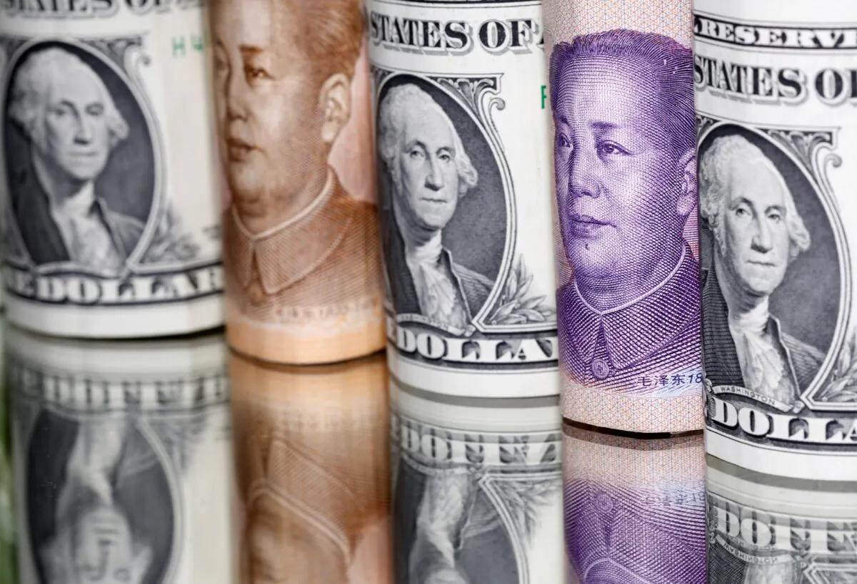 Chinese yuan and U.S. dollar banknotes are seen in this illustration taken on Feb. 10, 2020. (Dado Ruvic/Illustration/Reuters)