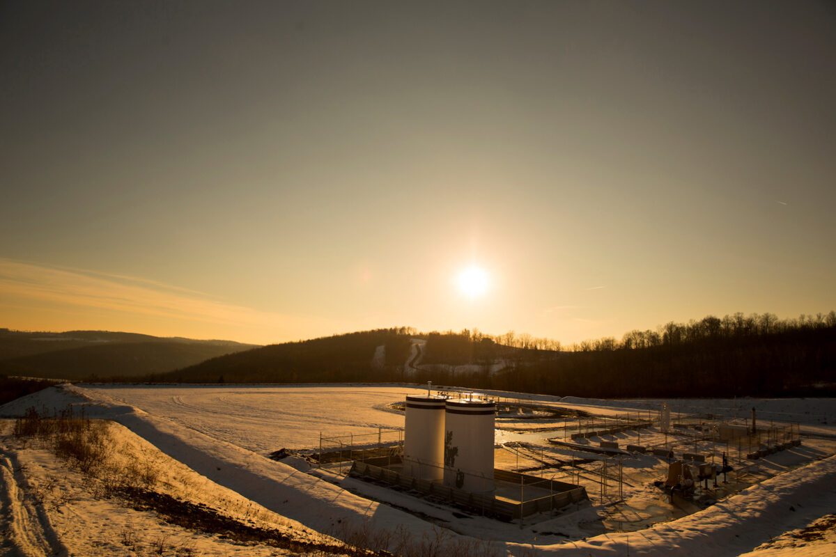 A Chesapeake Energy natural gas well pad rests on the hill in Litchfield Township, Penn.