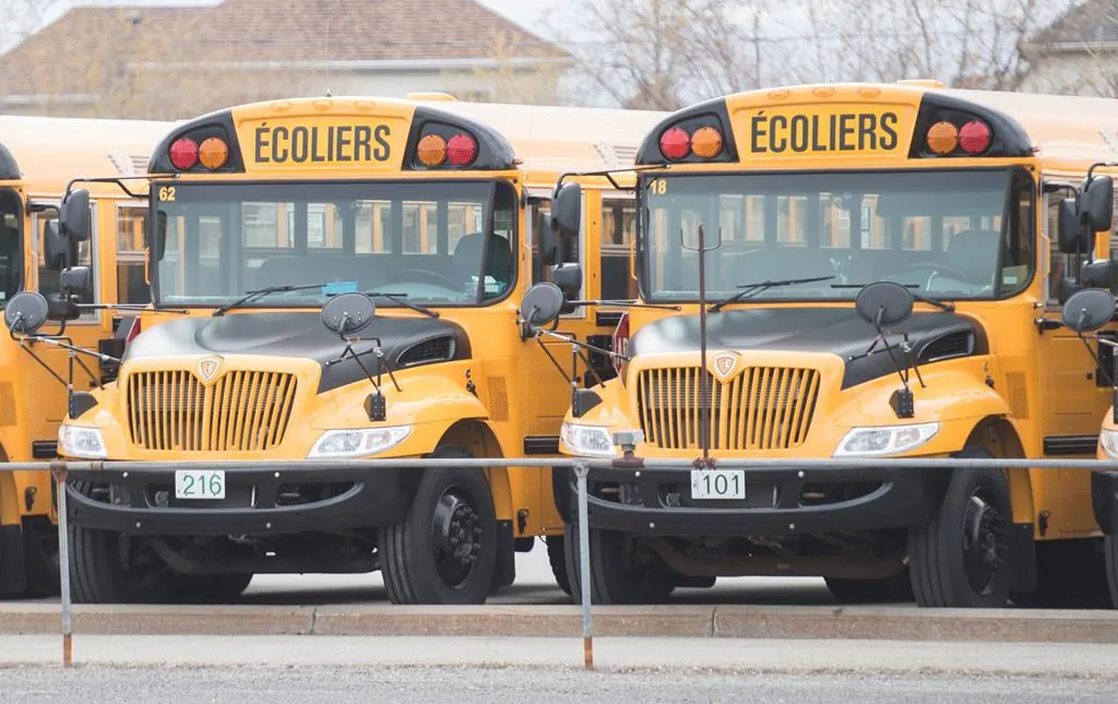 School buses are shown at a depot in Vaudreuil-Dorion, Que., west of Montreal, on May 10, 2020. (Graham Hughes/The Canadian Press)