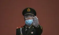 Chinese Fight Police Over Lockdown Passes; Chinese Media Fake Rescue Video