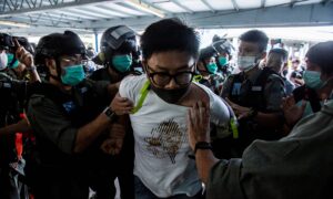 Hundreds Arrested as Hong Kong Protests Renew on Mother’s Day