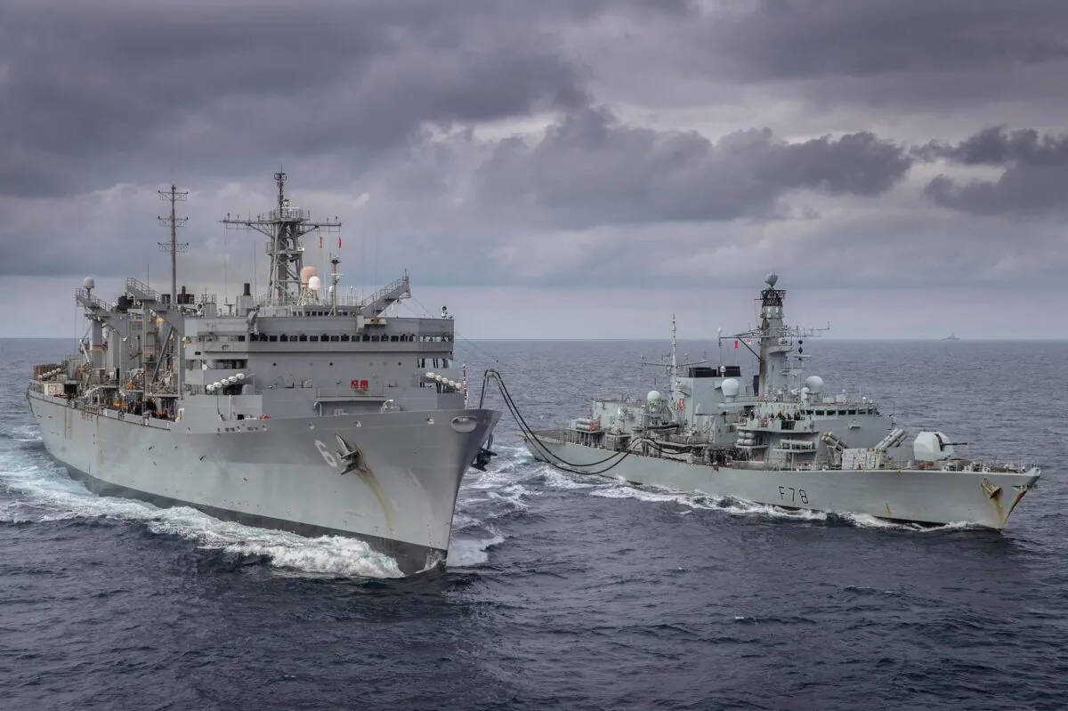 The fast combat support ship USNS Supply (T-AOE 6) and the Royal Navy Duke-class frigate HMS Kent (F78) conduct a replenishment-at-sea in the Barents Sea while training in the Arctic Circle on May 3, 2020. (U.S. Navy photo by Lt. Lauren Spaziano/Released)