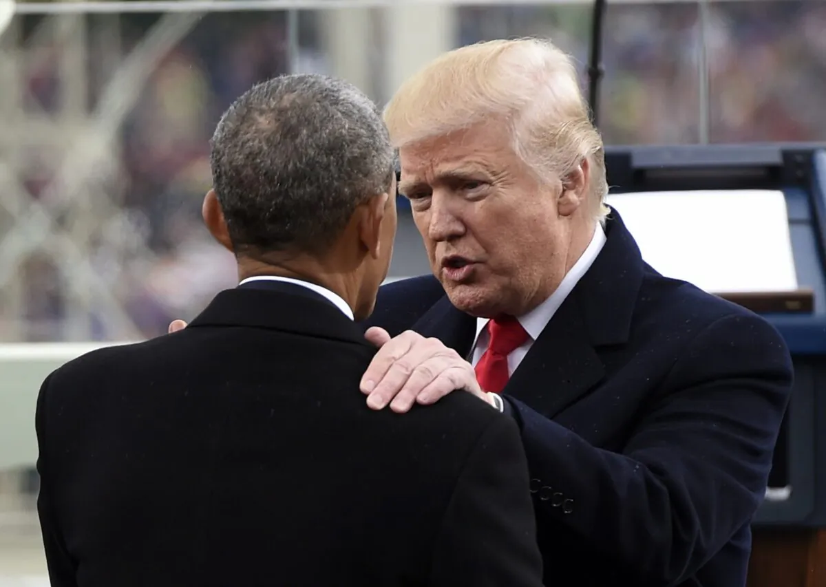 President Donald Trump speaks with former President Barack Obama during the Presidential Inauguration at the U.S. Capitol in Washington on Jan. 20, 2017. (Saul Loeb/Pool/Getty Images)