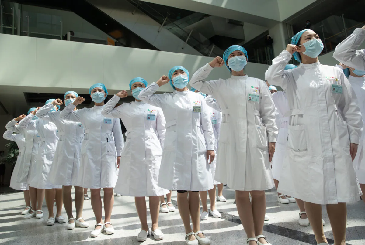 Nurses at Tongji Hospital follow the request and recite an oath in Wuhan, China on May 12, 2020. (STR/AFP via Getty Images)