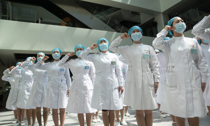 Nurses at Tongji Hospital follow the request and recite an oath in Wuhan, China on May 12, 2020. (STR/AFP via Getty Images)