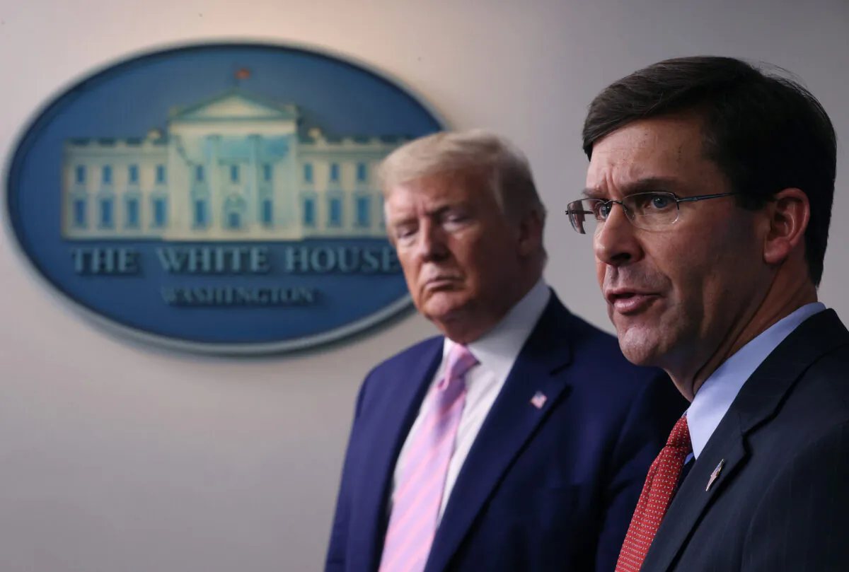 Secretary of Defense Mark Esper speaks as President Donald Trump listens during the daily White House coronavirus press briefing in Washington, on April 1, 2020. (Win McNamee/Getty Images)