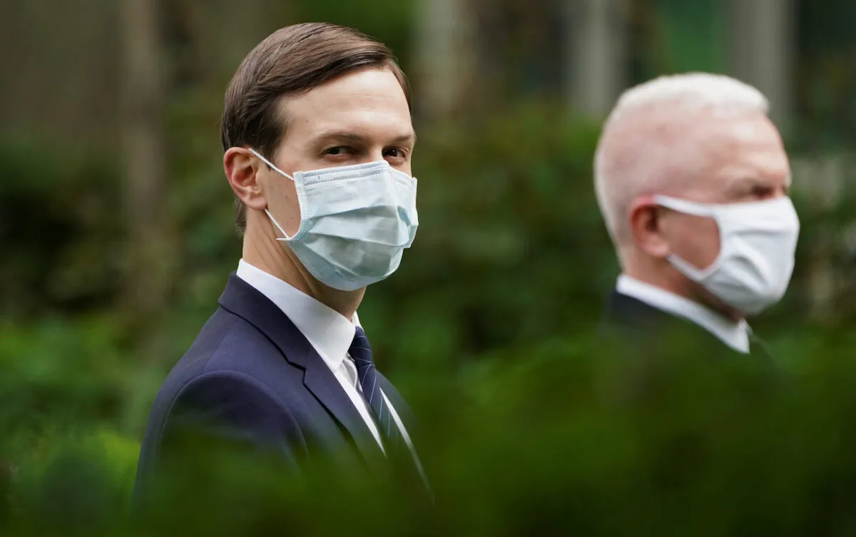 White House senior advisor to the president Jared Kushner and Admiral Brett Giroir, U.S. Assistant Secretary for Health, wear protective face masks in the Rose Garden as President Donald Trump holds a COVID-19 response press briefing at the White House in Washington on May 11, 2020. (Kevin Lamarque/Reuters)